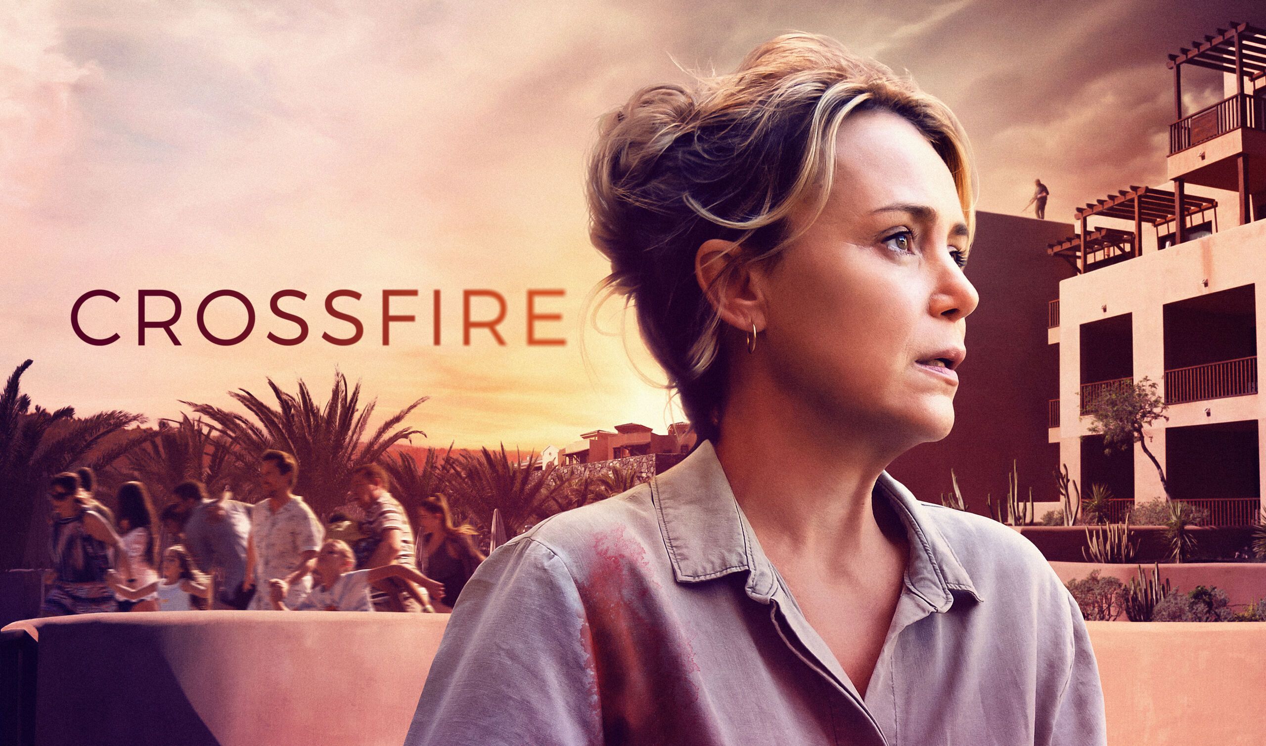 Crossfire BTS — A woman with blonde hair and a ponytail looks at the camera.