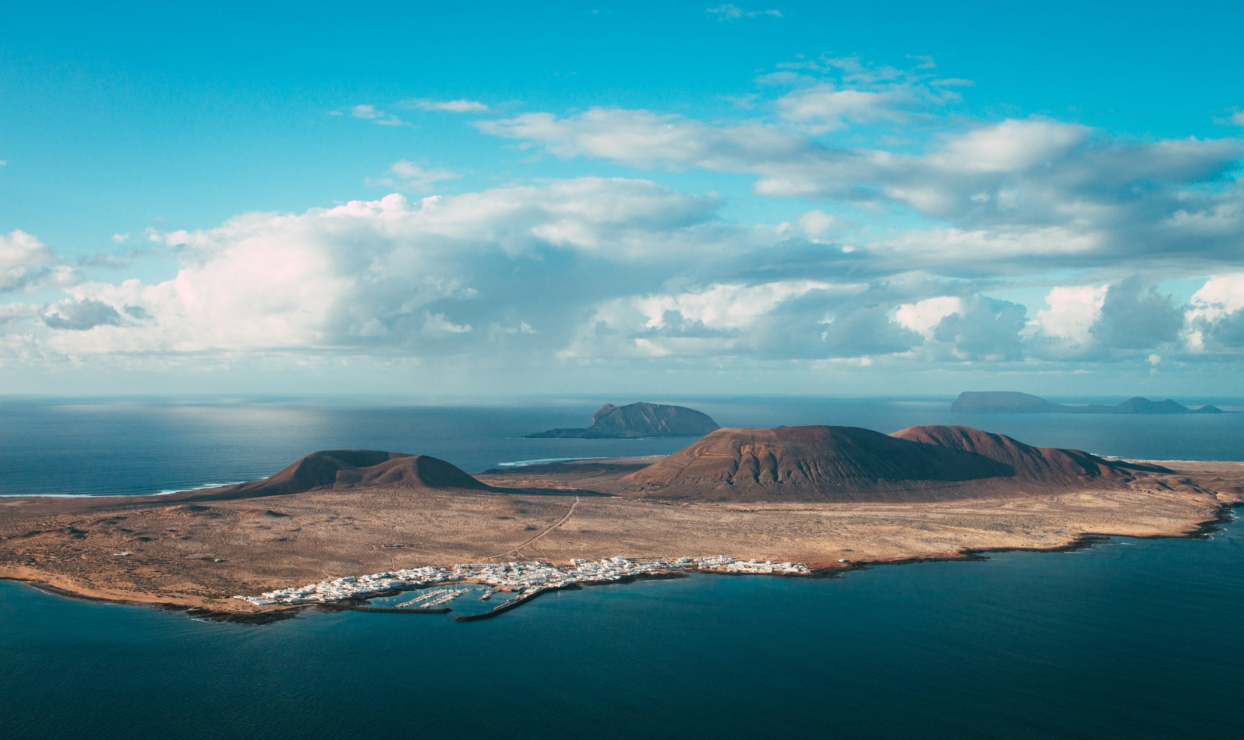 Hidden Canary Islands — A beautiful view of the ocean with mountains in the background.