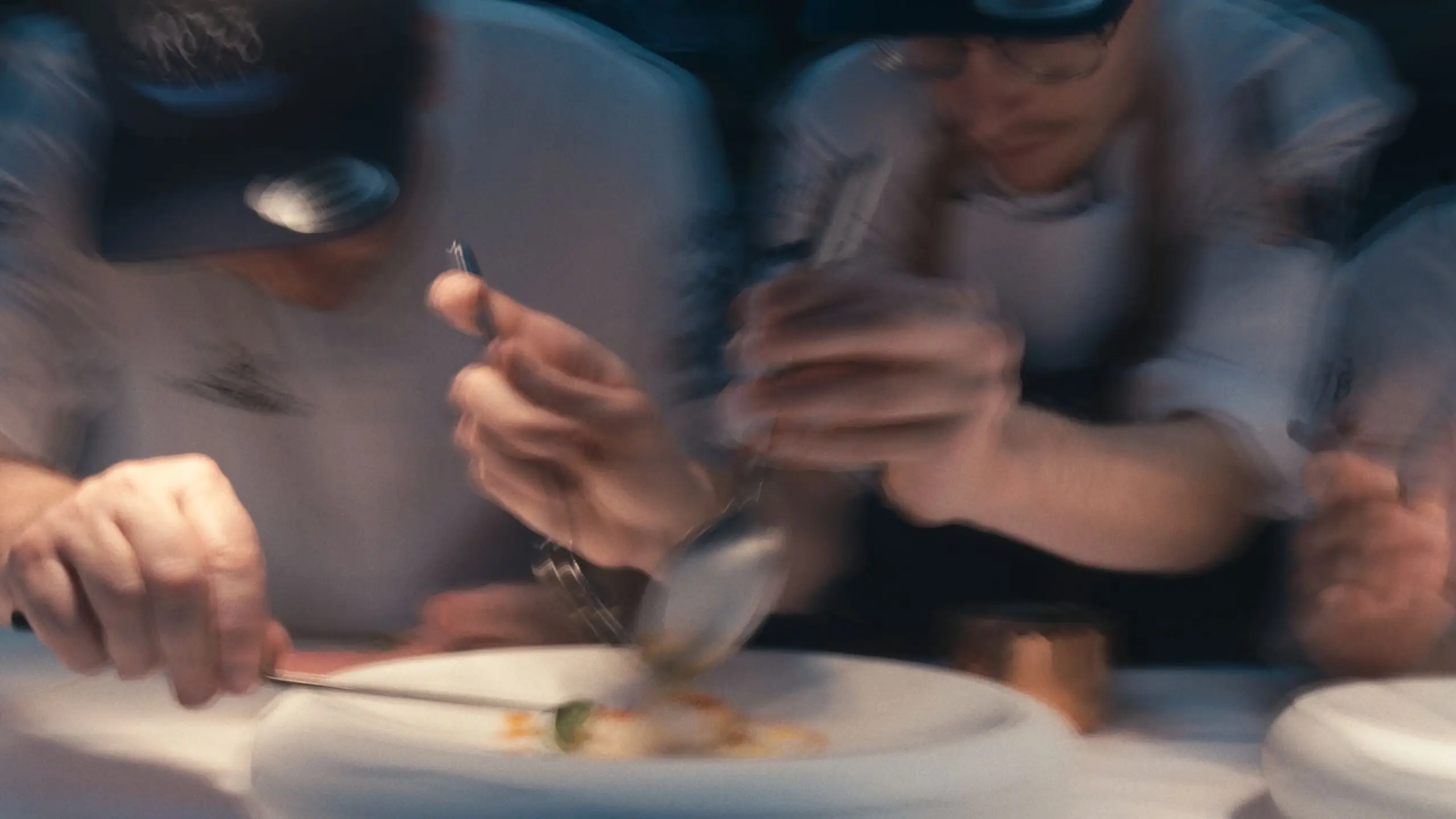 Taste 1973 — Two men are preparing food on a table.